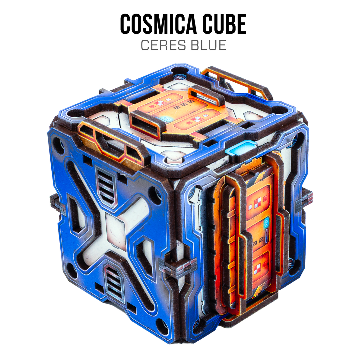 A futuristic metallic cube container labeled 'COSMICA CUBE' with 'ALTAIR BLUE' text above it, shown on a plain white background. The cube is primarily bright blue with orange glowing accents and dark gray structural details.